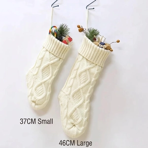 Cream knitted Christmas stockings with cable knit patterns in 37cm and 46cm sizes