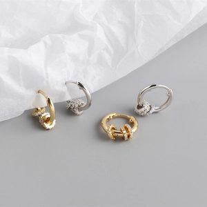 Close-up of S925 silver hoop earrings with movable zircon beads in gold and silver finish
