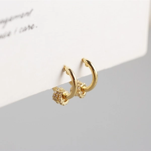 Detailed view of S925 silver gold hoop earrings with sparkling zircon pendant charms