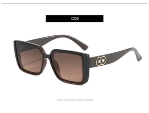 Detail of tortoise shell sunglasses frame with gold interlaced logo and crystal stud