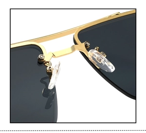 Macro view of gold metal bridge and soft silicone nose pads on rimless sunglasses