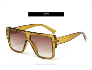 Detail view of square amber sunglasses with brown gradient lenses and C07 model marking