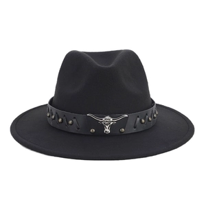 Close-up of black fedora with leather band featuring silver bull head and metal studs