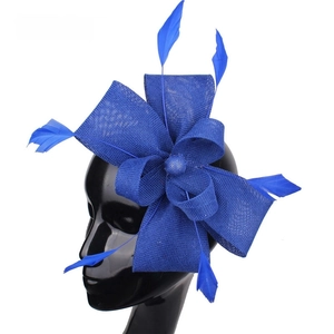 Blue Sinamay fascinator hat with elegant bow and feathers on a black mannequin head