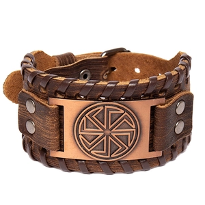 Vintage Viking leather bracelet with Nordic rune bronze plate on a brown horsehide band