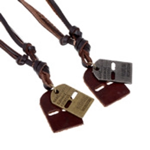 Detail of retro leather necklaces with engraved metal plates and brown leather tags