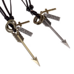 Detail of vintage bronze fishhook pendants with engraved metal plates on black ropes