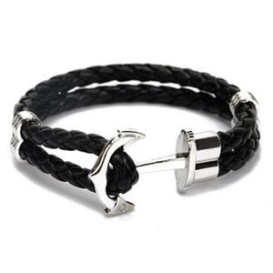 Close-up of black braided leather bracelet with silver anchor metal clasp and high polish