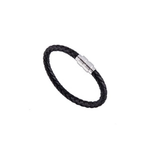 Detail of black braided leather bracelet featuring a silver magnetic clasp closure