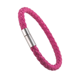 Close-up of rose red braided PU leather bracelet with silver magnetic cylinder clasp