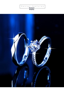 Detail view of classic six-prong moissanite couple rings set on reflective surface