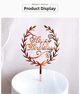 Detail of rose gold mirror acrylic Happy Birthday cake topper with wreath design