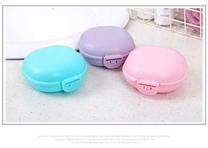 Three round plastic soap boxes in blue, purple, and pink with waterproof snap lids