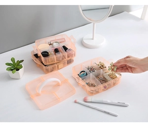 Detailed view of stackable pink plastic storage box with compartments and handle