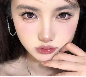 Close-up of model wearing stylish irregular silver hoop earrings and a matching necklace