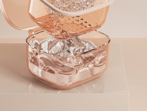 Detail view of the rose gold denture box featuring a dual-layer drainage filter basket