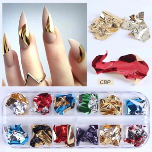 Macro detail of 12-slot nail art box featuring irregular metallic foil flakes for decoration