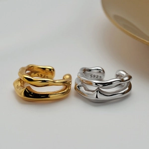 Macro shot showing the S925 sterling silver hallmark on the polished double layer ear cuff