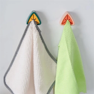 Creative wall-mounted triangular towel holder with cross-opening silicone design for bathroom
