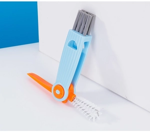 Detail of 3-in-1 multifunctional bottle brush with orange bristles and blue handle