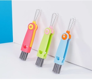 Three-in-one multifunctional cleaning brushes for bottles and lids in pink, green, and blue