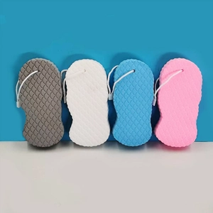 Detailed view of 3D bath sponges with fish scale texture in grey, white, blue and pink