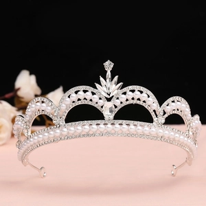 Macro detail of Baroque silver bridal tiara featuring white pearls and clear crystals