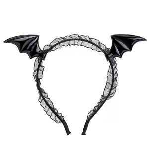 Detail of black bat wing headband with ruffled lace accents for Halloween parties