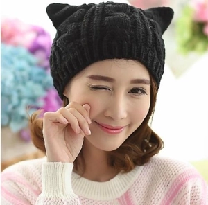 Women's black knit beanie with cute cat ears featuring a twisted cable pattern design