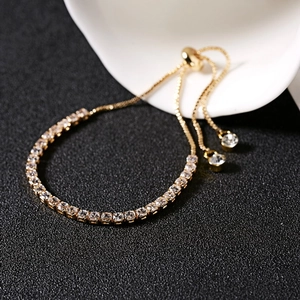 Detail of 3mm gold tennis bracelet with clear zircons and adjustable slider buckle