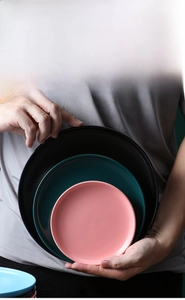 Detailed close-up of matte ceramic plates showing 6, 8, and 10 inch sizing options