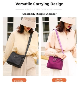 Detail of genuine cowhide leather crossbody bag showing dual carry styles in black and purple