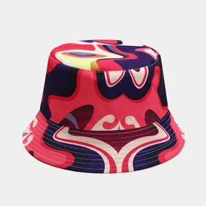Detail showing the colorful ethnic print and stitching on this reversible sun bucket hat