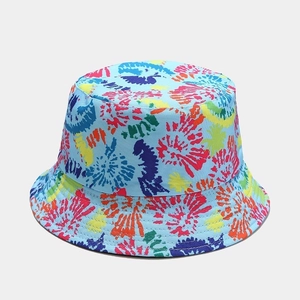 Detailed close-up showing the colorful tie-dye pattern and stitching of the bucket hat