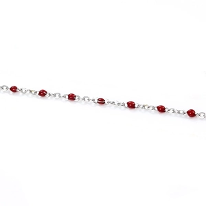 Detail of silver stainless steel chain with round red enamel beads for DIY jewelry making