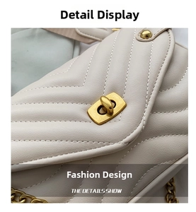 Detail of cream chevron quilted leather with vintage gold hardware and chain strap