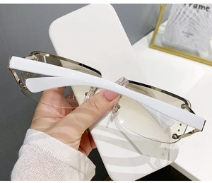 Detail showing white thick temples and golden metal semi-rim of Y2K gradient sunglasses