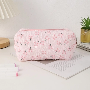 Detailed view of pink floral seersucker fabric texture on a large capacity pencil case