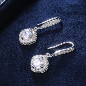 Luxury square zircon drop earrings with halo cushion design on elegant blue velvet