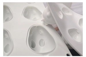 Close-up of flexible 6-cavity white silicone mold featuring 3D cartoon bunny designs