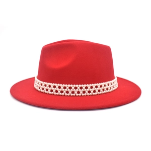 Detail of red wool Fedora hat featuring a triple-row pearl beaded decorative band