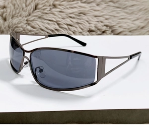 Detail of Y2K gunmetal sunglasses showing geometric hollow temples and nose pads