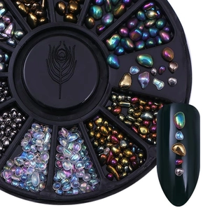 Detailed view of colorful nail art rhinestones and gems in a black wheel storage box