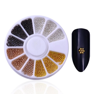 Manicure metal beads in white storage box with gold floral nail art decoration example