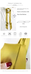 Detail view of ginger yellow silk scarf with size specs 5x200cm and fabric texture