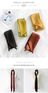 Detail showing various colors of narrow satin silk scarves with soft lustrous texture