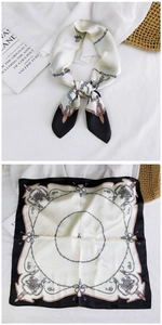 Detail of vintage square silk scarf with chain print and horse buckle pattern