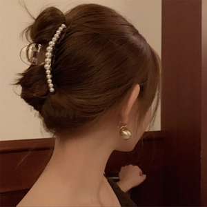 Elegant acrylic hair claw clip with white pearls and luxury branding for women
