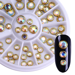 Detailed top view of a circular nail art wheel set with golden rimmed colorful rhinestones