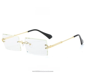 Side view of rimless rectangular sunglasses featuring diamond cut edges and golden temples